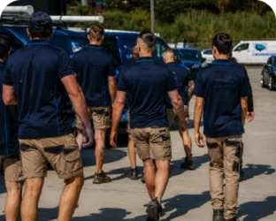 Plumbers walking to their service vans on a Normanhurst job